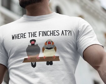 May include: White t-shirt with a black graphic of two finches wearing masks and the text "Where the finches at?"