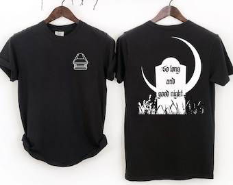 May include: Black t-shirt with a white coffin outline on the front. The back of the shirt features a white tombstone design with the words "So long and good night" and a crescent moon.