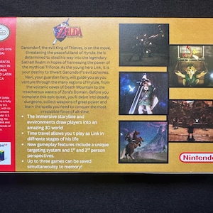 May include: The back of a gold-coloured Nintendo 64 The Legend of Zelda Ocarina of Time game box. It features a red vertical strip on the left with the Nintendo logo, game text, and plot summary. The right side displays four small screenshots of gameplay.