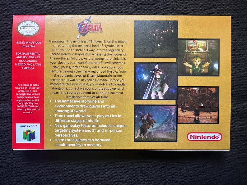 May include: The back of a gold-coloured Nintendo 64 The Legend of Zelda Ocarina of Time game box. It features a red vertical strip on the left with the Nintendo logo, game text, and plot summary. The right side displays four small screenshots of gameplay.
