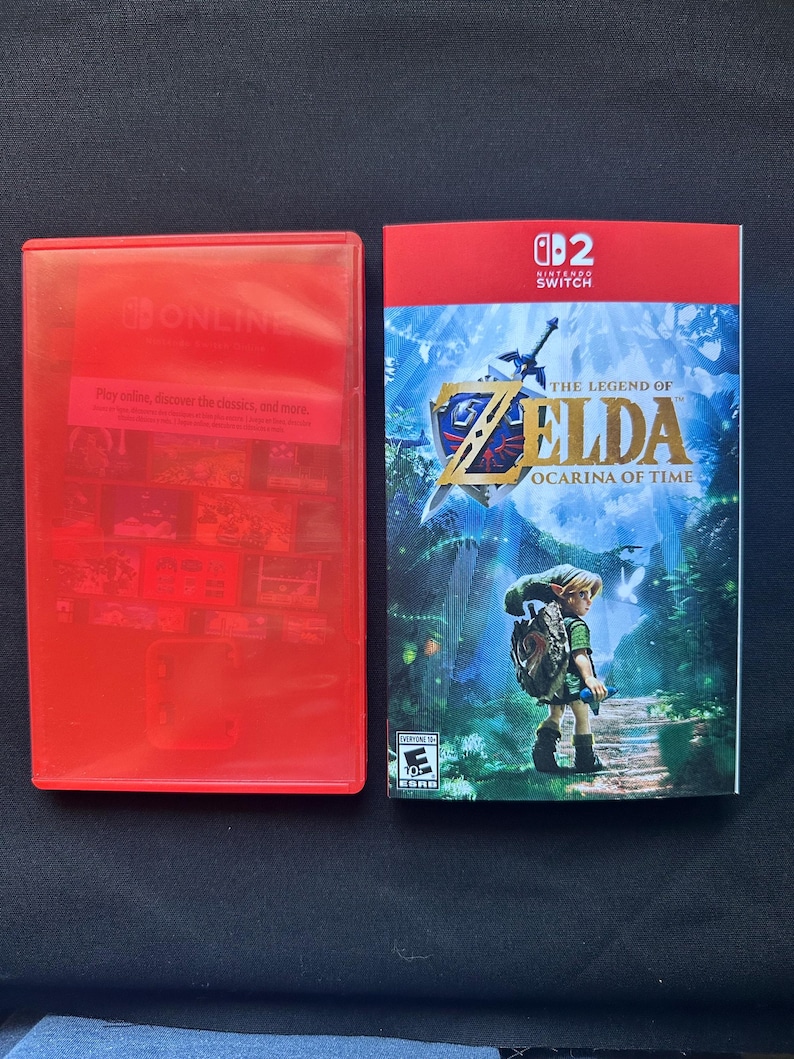 May include: A red plastic Nintendo Switch game case and a game cover insert for The Legend of Zelda: Ocarina of Time. The cover features a character in a forest, the game title in gold text, the Nintendo Switch logo, and an ESRB rating of Everyone 10+.