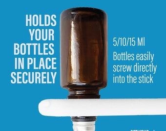 May include: An essential oil applicator with a brown glass bottle. The applicator holds bottles securely in place. The text on the image says "5/10/15 MI" and "Bottles easily screw directly into the stick."