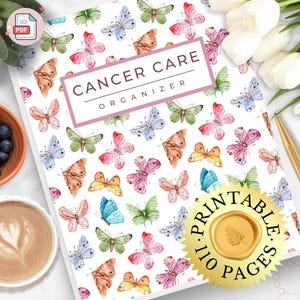 May include: A white notebook with a butterfly pattern and the text "CANCER CARE ORGANIZER". The cover features watercolor butterflies in various colors. A gold seal reads "PRINTABLE 110 PAGES".