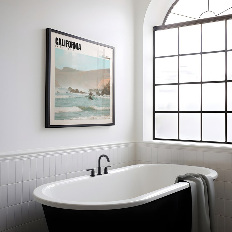 a bathroom with a bathtub and a picture on the wall