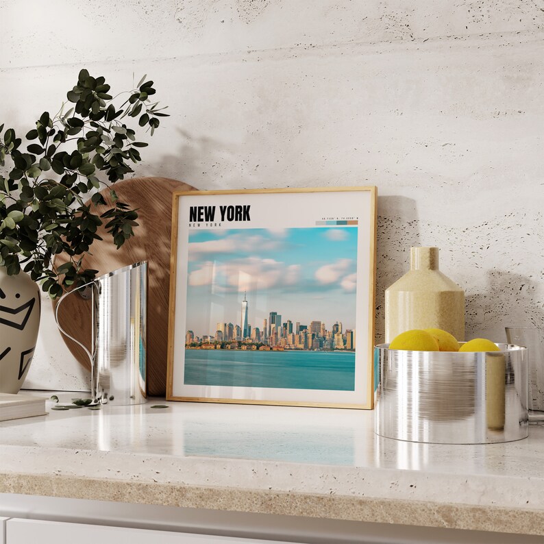 a picture of a city in a frame on a counter