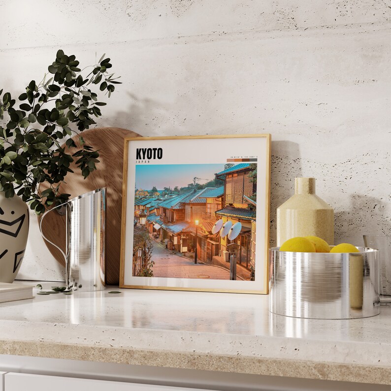 a picture of a picture of a street in a frame on a counter