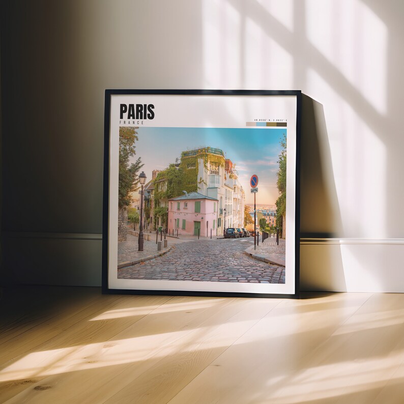 a picture frame sitting on a wooden floor in front of a window