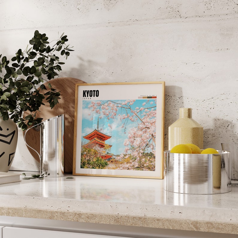 a picture of a building and a vase of flowers