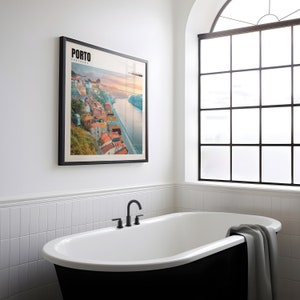 a bathroom with a bathtub and a picture on the wall