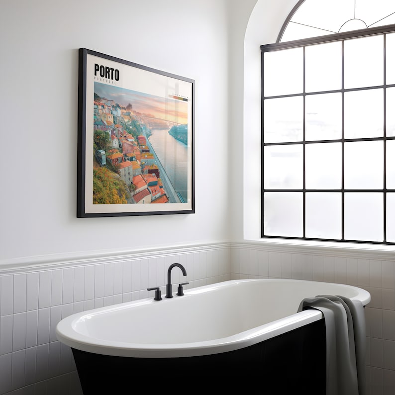 a bathroom with a bathtub and a picture on the wall