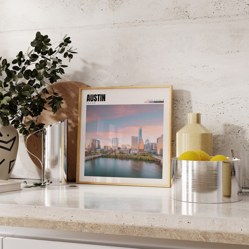 a picture of a city in a frame on a counter