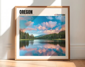 May include: A framed print with a scenic landscape of a lake surrounded by trees and a cloudy sky. The print features the text "OREGON" and "UNITED STATES" in black text. The print also includes a color palette with shades of blue, green, and brown.