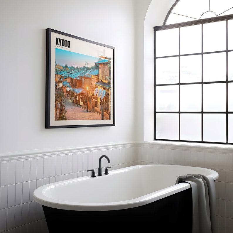 a bathroom with a bathtub and a picture on the wall