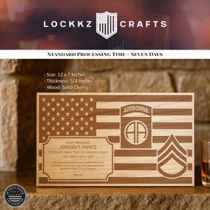 May include: A wooden plaque with an American flag design, engraved with text. The plaque includes the text "LOCKKZ CRAFTS", "STAFF SERGEANT JORDAN T. PIERCE", and "AIRBORNE". The plaque is 12 x 7 inches and made of solid cherry wood.