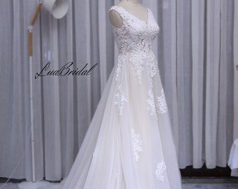 wedding dress with V neckline. A-line wedding dress. custom wedding dresses. handmade beaded wedding dress.