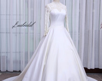 luxury princess wedding dress. White Princess wedding dress with long sleeves. Minimalist and sophisticated custom wedding dresses.