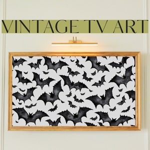 May include: A framed print with a black and white watercolor pattern of bats on a white background. The print is in a wooden frame with a gold finish.