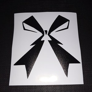 May include: Black and white vinyl sticker of a large bow.