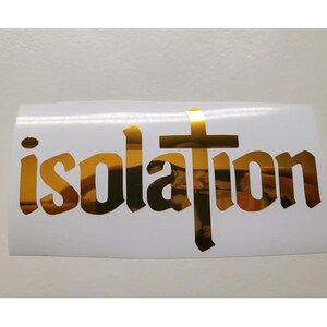 May include: Gold vinyl decal with the word "isolation" in a gothic font with a gold cross in the center.