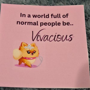 May include: A pink square with the text "In a world full of normal people be.. Vivacious." A cartoon Pomeranian dog with a crown and leash is featured below the text. The dog is orange and white.