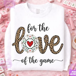 May include: White sweatshirt with the text "for the love of the game". The word "love" is designed with a leopard print pattern and a heart in the center. Mahjong tiles are arranged around the heart.