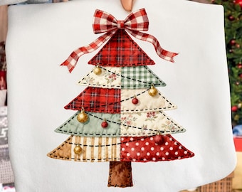May include: White cushion cover featuring a patchwork Christmas tree design. The tree is made of red plaid, floral, and polka dot patterns, decorated with gold baubles and a plaid bow. A festive holiday decoration.