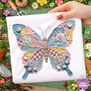 May include: A white square textile featuring a patchwork butterfly design. The butterfly has wings made of various fabric patterns in blue, pink, yellow, and red. Small, decorative buttons are sewn onto the wings. The butterfly's body is tan.