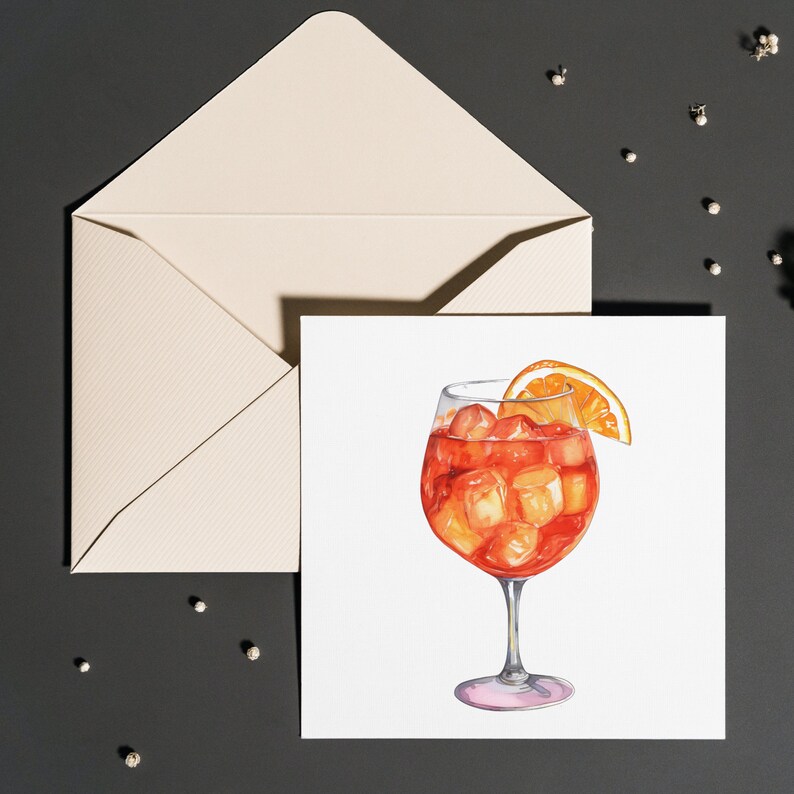 May include: Watercolor illustration of an Aperol Spritz cocktail in a stemmed glass with ice cubes and an orange slice. A cream-colored envelope is in the background. The image is on a white card.