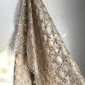 Hand holding real mirror work dupatta showing genuine mirrors and hand embroidery detail