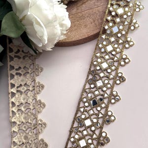 Handcrafted Indian mirror lace trim roll in gold, perfect for DIY festival outfits, waist belts, and dance costume embellishments.