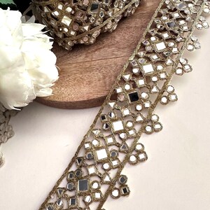 2.5-inch wide golden mirror lace with triangle, square, and circular mirrors, designed for couture belts, gowns, and DIY accessories.