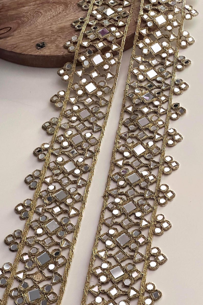 Golden sequin and mirror work border lace used for making bridal sashes, lehenga belts, and decorative costume accessories.