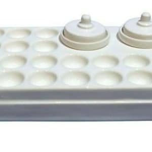 May include: White ceramic tray with 36 individual wells, designed for holding small items. Two white ceramic lids are included.