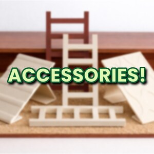 May include: A collection of small, light-colored plastic accessories including two ladders and two slanted ramps, with the word ACCESSORIES! printed in large green letters across the center of the image, set against a plain background.