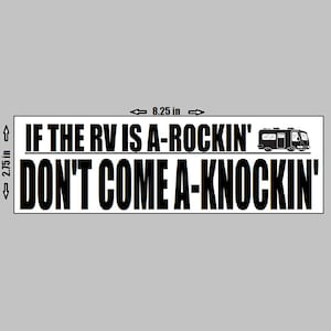May include: Black and white rectangular sticker with the text "IF THE RV IS A-ROCKIN' DON'T COME A-KNOCKIN'". The sticker is 21 cm wide and 7 cm tall. A small RV graphic is on the right side.