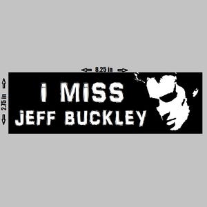 May include: Black rectangular bumper sticker with the text "I MISS JEFF BUCKLEY" in white, along with a white silhouette of a person's face. The sticker is 8.25 inches long and 2.75 inches high.