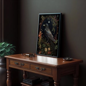 May include: A framed print of a black crow perched on a branch in a forest setting. The crow is surrounded by flowers and leaves, and the background is a dark blue sky with stars. The print is in a black frame.