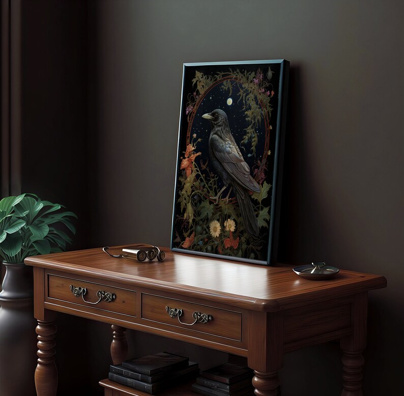 May include: A framed print of a black crow perched on a branch in a forest setting. The crow is surrounded by flowers and leaves, and the background is a dark blue sky with stars. The print is in a black frame.