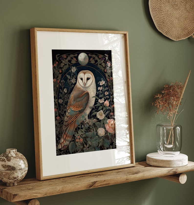 May include: Framed art print featuring a detailed illustration of a barn owl perched amidst floral elements. The owl has a white face and brown and tan feathers. The artwork is set against a dark background with a light-colored frame, creating a nature-inspired aesthetic.