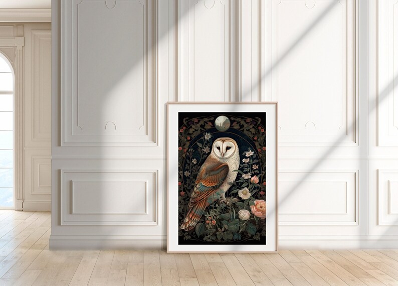 May include: Framed art print featuring a detailed illustration of a barn owl perched on a flowering branch. The owl has white, brown, and tan feathers, set against a dark background with floral and moon details. The artwork is displayed in a light wood frame.