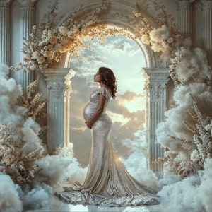May include: A pregnant woman in a shimmering gold sequined gown stands in a white archway decorated with white flowers. The background features a cloudy sky and white clouds.