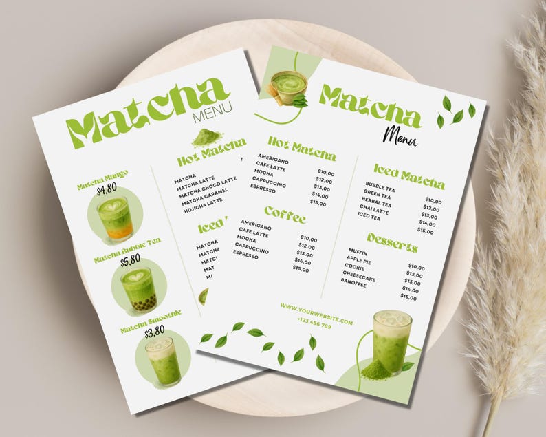 May include: Two matcha menu flyers on a wooden plate. The menus list matcha drinks, coffee, and desserts. The menus have green text and illustrations of matcha drinks. The text includes "Matcha Menu" and drink prices.