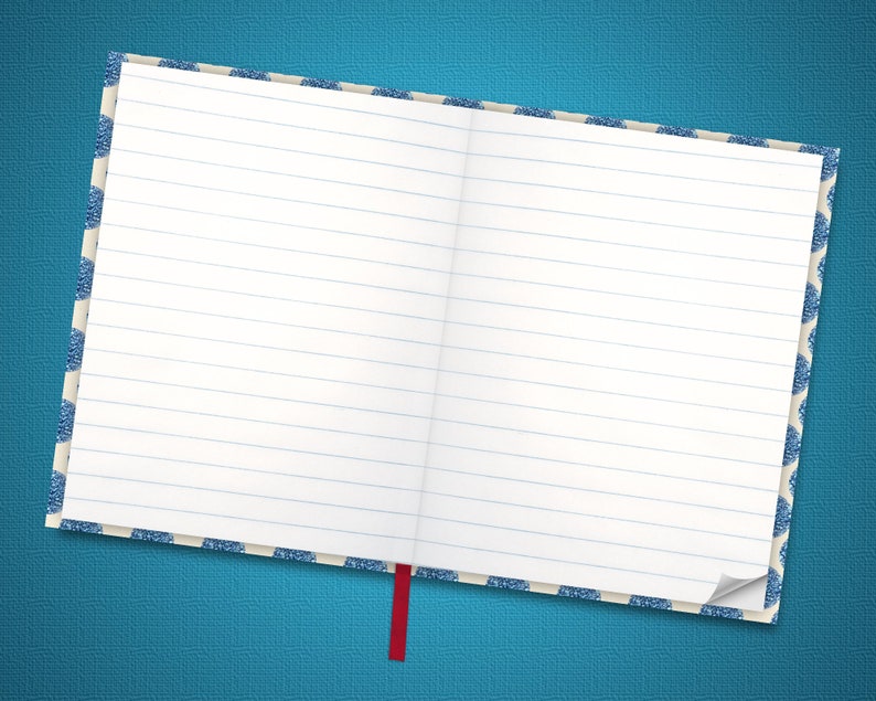 May include: A blank, lined notebook with a blue and white patterned cover and a red ribbon bookmark. The notebook is open and lying flat on a blue surface.