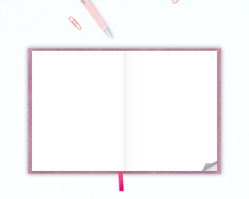 May include: A pink notebook with a white interior and a pink ribbon bookmark. The notebook is open and the pages are blank.