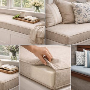 May include: A collection of neutral-toned window seat cushions and throw pillows. The cushions are rectangular with a light beige fabric and a contrasting border. Decorative pillows feature floral and striped patterns. A hand is shown pulling back the cushion fabric.