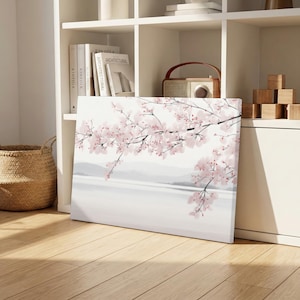 Puede incluir: Un juego de tres tazas de cerámica con un esmalte moteado de color crema. Cada taza presenta un diseño pintado a mano diferente: una hoja azul y verde, una flor amarilla y una baya roja. Las tazas tienen una forma simple y redondeada.