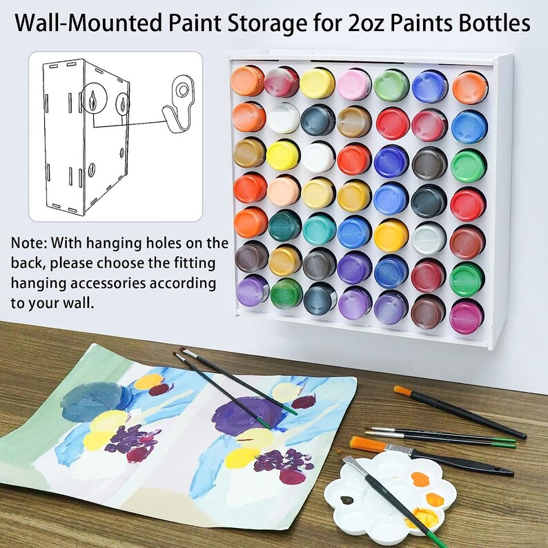 May include: White wall-mounted paint storage rack with 36 slots for 2 ounce paint bottles. The rack is made of wood and has a simple design. The rack is shown with a variety of colored paint bottles. The image also shows a painting, paint brushes, and a paint palette.