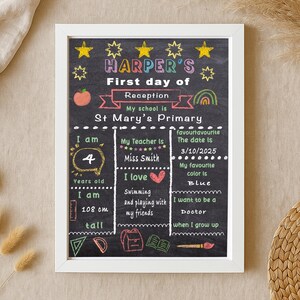 May include: A framed chalkboard-style sign with white lettering and colorful illustrations. The sign reads "Harper's First day of Reception" and includes details about the child's age, height (108 cm), favorite color, and aspirations. The frame is white.