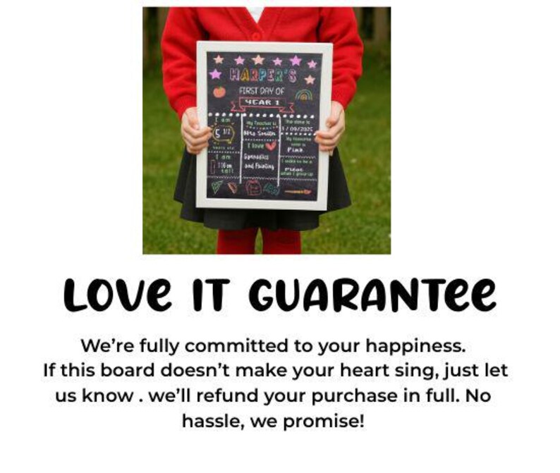May include: A chalkboard sign with a white frame held by a person. The sign reads "HARPER'S FIRST DAY OF YEAR 1" with colorful illustrations and text. The sign includes the date 1/09/2025 and other details.