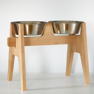 Customizable dog bowl stand, elevated pet feeder, beech wood large dog feeding station. Handmade wooden pet bowl holder with rustic design. Elevated dog food stand, personalized and unique pet dining stand. Perfect for a customized pet bowl setup.